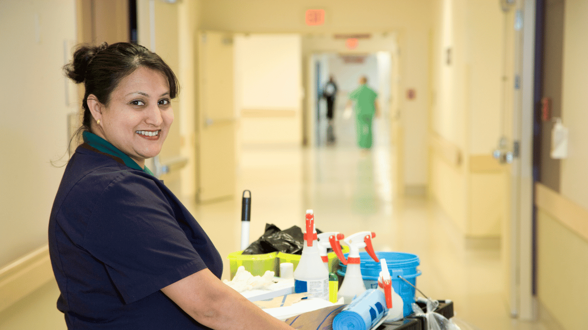 Dust mopping hospital floor